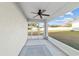 The screened patio features a ceiling fan and access to the spacious backyard at 4955 Se 89Th Place Rd, Ocala, FL 34480