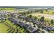 Aerial view of the community featuring uniform homes with well-kept lawns and green spaces in a residential area at 4970 Nw 35Th Lane Rd, Ocala, FL 34482