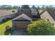 An aerial view showcases the home's roof, landscaping, and surrounding greenery at 4970 Nw 35Th Lane Rd, Ocala, FL 34482