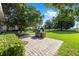 Brick patio featuring a built-in grill in a landscaped backyard setting at 4970 Nw 35Th Lane Rd, Ocala, FL 34482