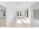 Sunny room features many windows, white walls, and light wood-look floors at 4970 Nw 35Th Lane Rd, Ocala, FL 34482