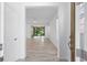 Bright foyer featuring tiled floors and a view into the living spaces and backyard at 4970 Nw 35Th Lane Rd, Ocala, FL 34482