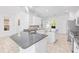 Bright kitchen featuring granite countertops, white cabinets, and stainless steel appliances at 4970 Nw 35Th Lane Rd, Ocala, FL 34482