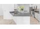 A stylish kitchen boasts granite countertops, stainless steel appliances, and modern cabinetry at 4970 Nw 35Th Lane Rd, Ocala, FL 34482