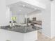 A stylish kitchen boasts granite countertops, stainless steel appliances, and modern cabinetry at 4970 Nw 35Th Lane Rd, Ocala, FL 34482