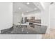 A stylish kitchen boasts granite countertops, stainless steel appliances, and modern cabinetry at 4970 Nw 35Th Lane Rd, Ocala, FL 34482