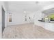Bright living room featuring tile floors, neutral walls, and access to the outside at 4970 Nw 35Th Lane Rd, Ocala, FL 34482