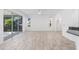 Open living room with tile floors, access to the patio, and views of the backyard at 4970 Nw 35Th Lane Rd, Ocala, FL 34482