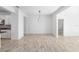 Spacious living room with tile floors and an open view into the dining and kitchen areas at 4970 Nw 35Th Lane Rd, Ocala, FL 34482