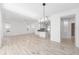 Bright, open living room with tile floors and a view into the dining and kitchen areas at 4970 Nw 35Th Lane Rd, Ocala, FL 34482