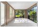 Relaxing screened porch with views of a lush, fenced backyard at 4970 Nw 35Th Lane Rd, Ocala, FL 34482
