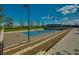 A tennis court with lighting for nighttime play at 4970 Nw 35Th Lane Rd, Ocala, FL 34482