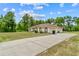 Beautiful single-story home with an extra long driveway and well manicured lawn at 4973 Sw 107Th Loop, Ocala, FL 34476