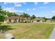 Beautiful single-story home with a well manicured lawn, landscaping and large trees at 4973 Sw 107Th Loop, Ocala, FL 34476