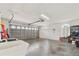 Attached garage with an automatic garage door and overhead lighting at 4973 Sw 107Th Loop, Ocala, FL 34476