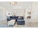 Spacious living room featuring comfortable seating, tile floors, and an open layout leading to the kitchen area at 4973 Sw 107Th Loop, Ocala, FL 34476