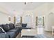 Bright and airy living room with high ceilings, stylish furnishings, and elegant lighting fixtures at 4973 Sw 107Th Loop, Ocala, FL 34476