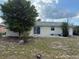 Backyard with a sliding glass door and an area for a patio at 499 Water Rd, Ocala, FL 34472
