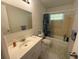 Full bathroom with sink, toilet, and shower/tub combo featuring shower curtain at 499 Water Rd, Ocala, FL 34472