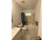 Full bathroom with sink, toilet, and shower/tub combo featuring shower curtain at 499 Water Rd, Ocala, FL 34472