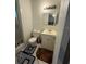 Full bathroom featuring toilet, sink, vanity, and a decorative floor mat at 499 Water Rd, Ocala, FL 34472