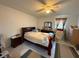 Bedroom with a dark wood bed frame and tile floors at 499 Water Rd, Ocala, FL 34472