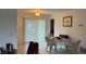 Bright dining area with sliding glass doors leading to the yard at 499 Water Rd, Ocala, FL 34472