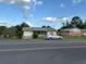 Charming one-story home featuring a well-maintained lawn and a classic, inviting facade at 499 Water Rd, Ocala, FL 34472