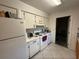 Modest kitchen with white appliances and plenty of cabinet space at 499 Water Rd, Ocala, FL 34472