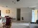 The living room and dining area have tile flooring and white walls at 499 Water Rd, Ocala, FL 34472