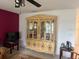 Living room with a classic china cabinet and neutral paint tones at 499 Water Rd, Ocala, FL 34472