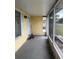 Enclosed porch with neutral colors and plenty of natural light at 499 Water Rd, Ocala, FL 34472