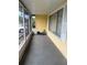 Enclosed porch with bright yellow walls and large windows at 499 Water Rd, Ocala, FL 34472
