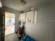 Large storage area with white cabinets and access to the kitchen at 499 Water Rd, Ocala, FL 34472