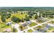Expansive aerial view of the neighborhood showcasing homes, green spaces, and a serene community setting at 5 Dogwood Loop Ave, Ocala, FL 34472
