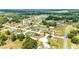 Community aerial view highlighting the layout, featuring houses with ample yards and proximity to green areas at 5 Dogwood Loop Ave, Ocala, FL 34472