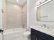 Bright bathroom featuring modern vanity, tub-shower combo, and sleek design at 5 Dogwood Loop Ave, Ocala, FL 34472