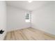 Minimalist bedroom with hardwood floors, natural light, and fresh paint at 5 Dogwood Loop Ave, Ocala, FL 34472