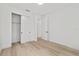 This bedroom features hardwood floors, closet, and natural light at 5 Dogwood Loop Ave, Ocala, FL 34472