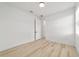Bright bedroom with light wood floors, white trim, and abundant natural light at 5 Dogwood Loop Ave, Ocala, FL 34472