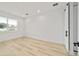 Bedroom with a sliding barn door, recessed lights, and a large window at 5 Dogwood Loop Ave, Ocala, FL 34472