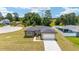 Lovely home with a paved driveway, two-car garage, and a well-manicured front yard at 5 Dogwood Loop Ave, Ocala, FL 34472
