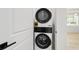 Efficient laundry area featuring a stackable washer and dryer set at 5 Dogwood Loop Ave, Ocala, FL 34472