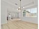 Open floor plan featuring hardwood floors, recessed lighting, and an open concept kitchen at 5 Dogwood Loop Ave, Ocala, FL 34472