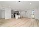 Spacious living room with sleek light-colored flooring and plenty of natural light at 5 Dogwood Loop Ave, Ocala, FL 34472