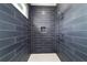 Updated bathroom features a modern, tiled walk-in shower with built-in niche at 5 Dogwood Loop Ave, Ocala, FL 34472