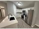 Bright kitchen featuring white cabinets, modern appliances, and a stylish island at 5 Laurel Pass Ln, Ocala, FL 34472