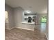 Modern kitchen with white cabinets, stainless steel appliances, and a breakfast bar at 5 Laurel Pass Ln, Ocala, FL 34472
