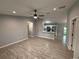 Open-concept living space with tile flooring, neutral paint, and a ceiling fan at 5 Laurel Pass Ln, Ocala, FL 34472