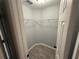 A walk-in closet has built-in wire shelving and wood-look tile flooring at 5 Laurel Pass Ln, Ocala, FL 34472